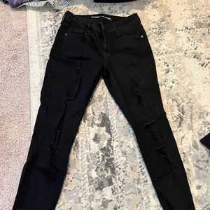 Old Navy Mid-Rise Rockstar Jean with holes down the leg Size 8 regular